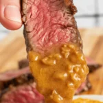 Cowboy butter recipe featuring butter, garlic, and fresh herbs for grilling steaks.